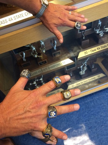Coach Croell displays six championship rings. Are there more in Broomfield's future?