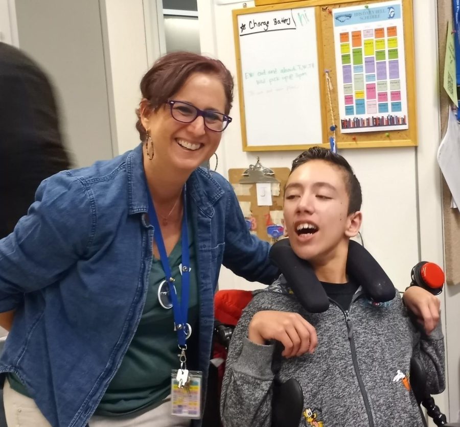 What+a+laugh%21+Ms.+Grayson+poses+with+one+of+her+students%2C+Jadyn+%2826%29.+Jadyn+is+a+wheelchair+user+and+can+relate+to+some+of+the+issues+and+solutions+mentioned+in+the+article.+Jadyn+loves+to+laugh+and+make+new+friends.