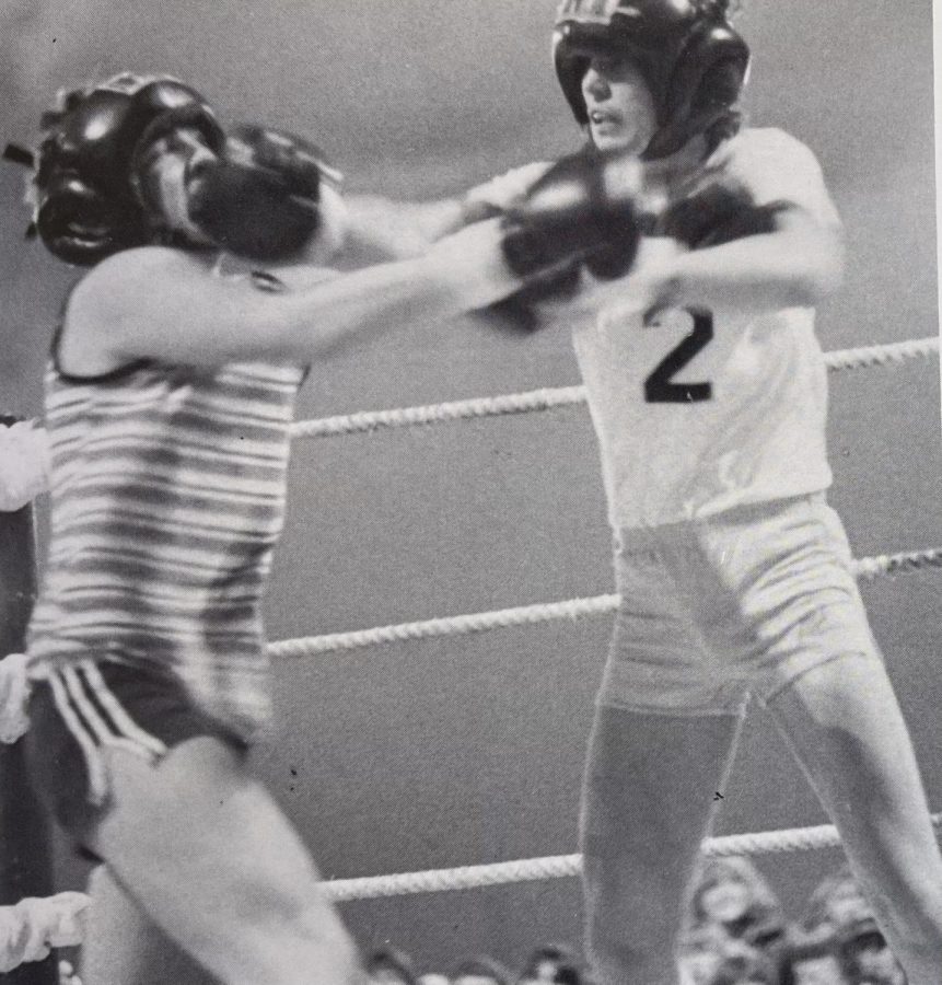 From the 1982 Eagle Yearbook: While blocking junior, Steve Markhams punch, junior Allen Price strikes his opponent during the second annual Smoker boxing match.