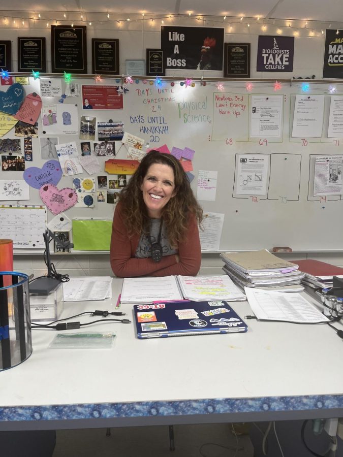 Ms. Nitchoff takes a break from grading and planning to share a smile.