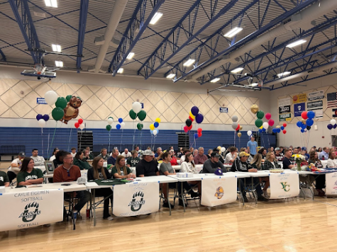 The student athletes and their families during Mrs. Ramsey’s speech on Signing Day.