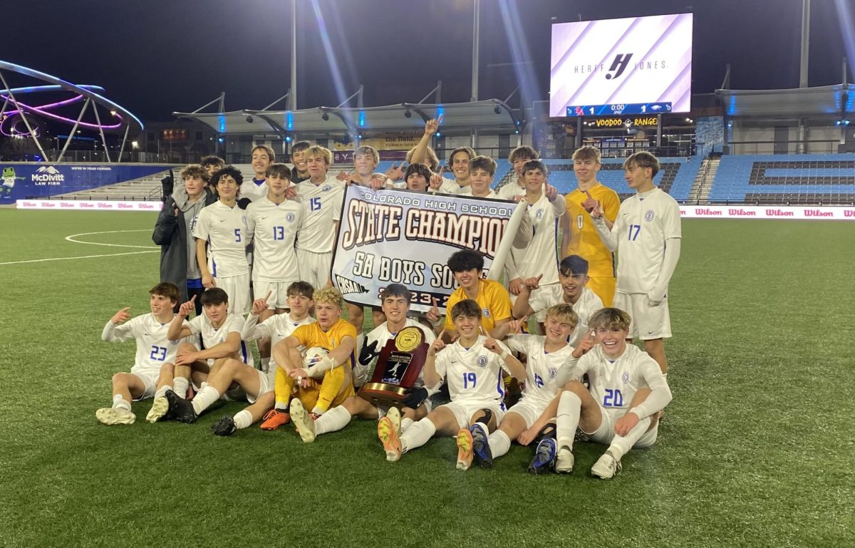 The boys soccer team poses for a team photo at the conclusion of their winning PK shootout in the state championship on November 11.