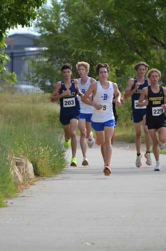 Charpentier pacing the top pack in the Broomfield Battle race. Charpentier ended up placing 5th overall in the boys varsity category.