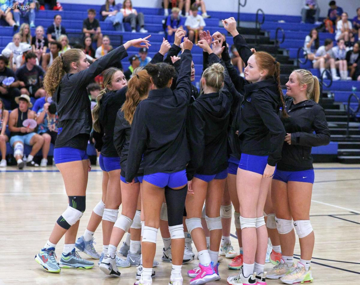 Lady Eagles Volleyball unites before a match in the Eagle Gym.