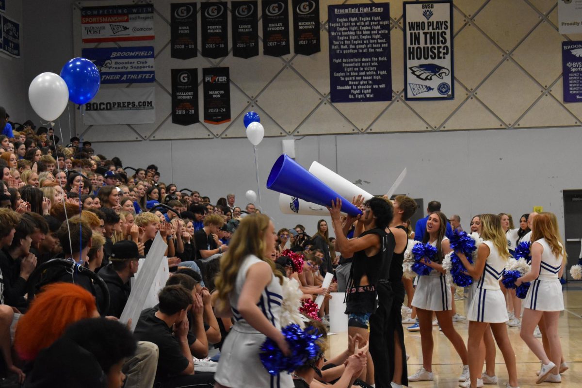 Students cheer from the stands during the 2024 homecoming assembly.
